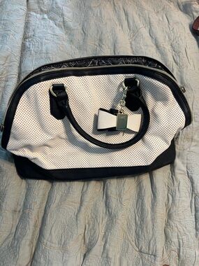 Betsey Johnson Black and White Perforated Satchel with Bow Charm
